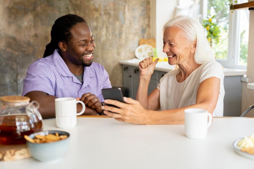 Home african social worker helping senior woman