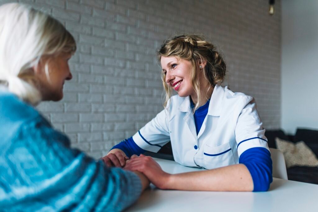 woman talking nurse retirement home